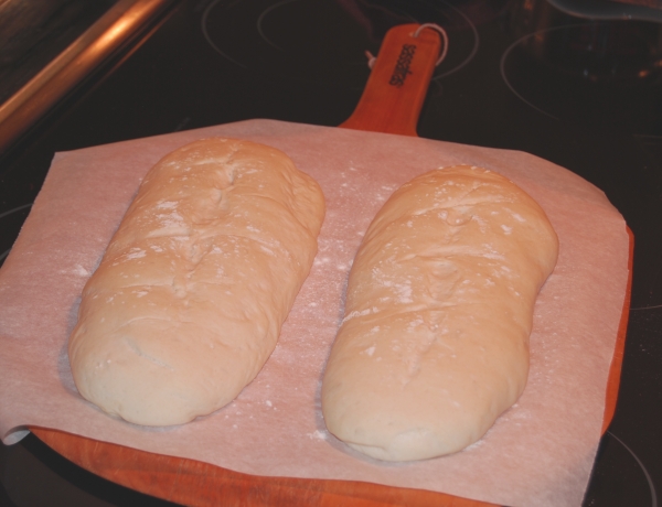 Crusty Italian loaves ready to go into the oven